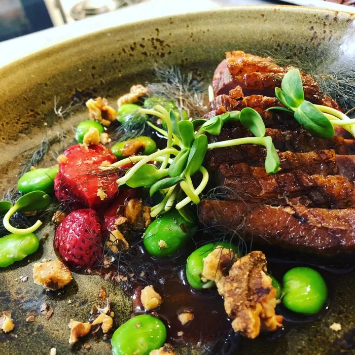 Seared duck with strawberries, fava beans and walnuts at Restaurant Beck