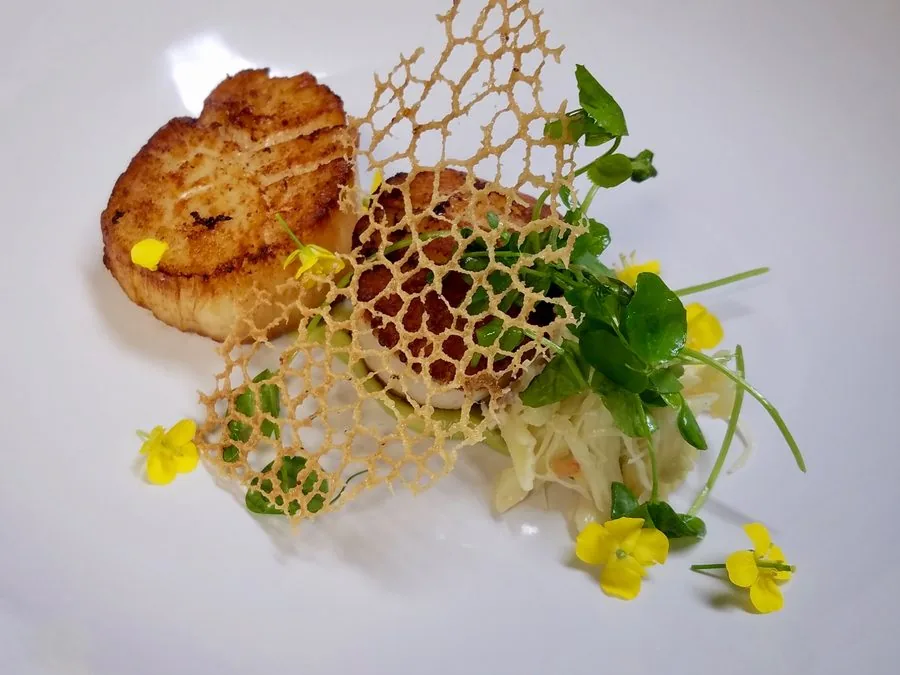 Seared scallops with sweet corn and a lace tuile at Restaurant Beck